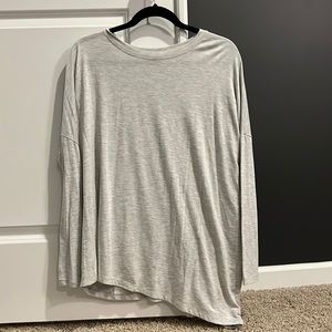 Athleta Grey Long Sleeve Shirt Asymmetrical hemline, size Small.